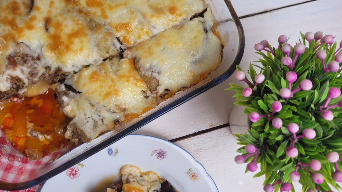 Top view of a cheesy baked moussaka served on a plate, perfect for food photography.